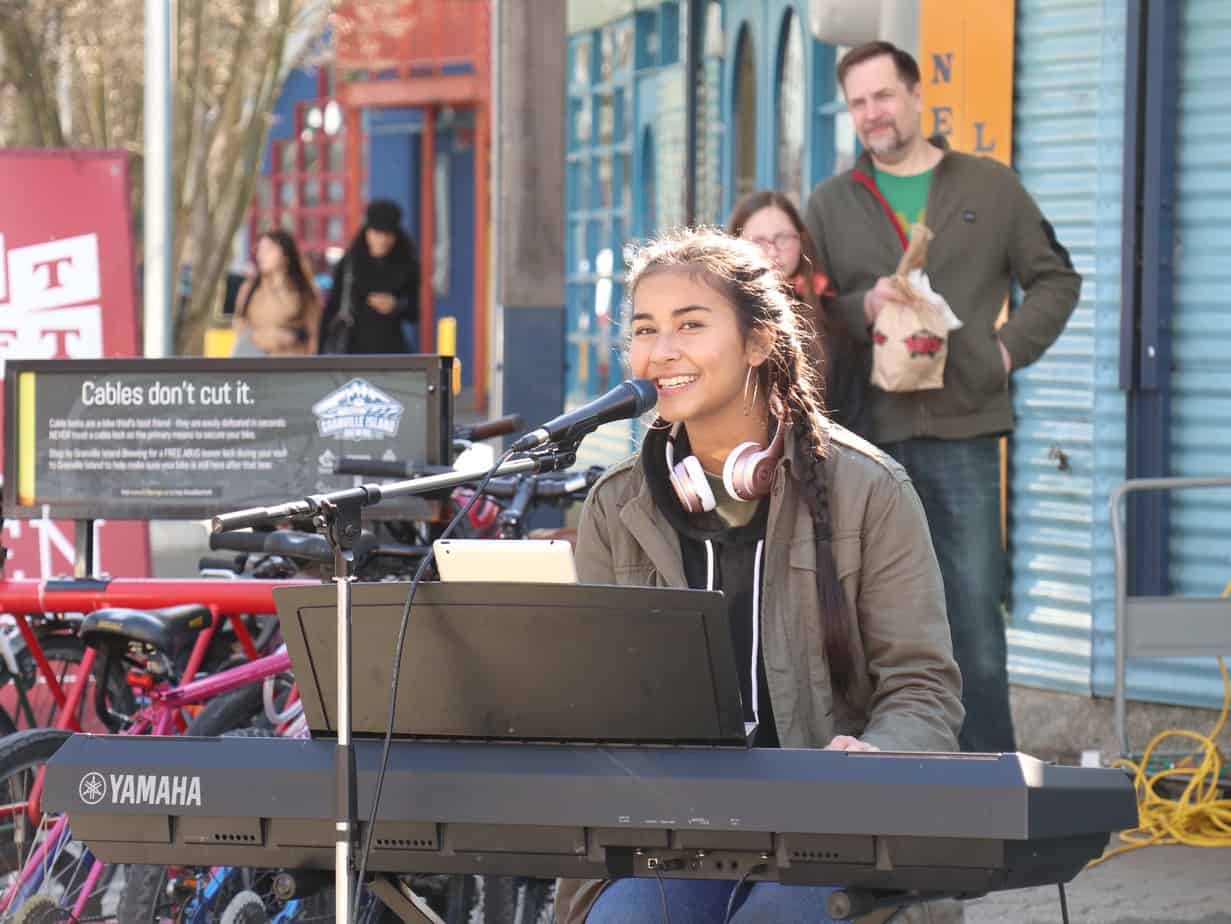Brianna performing outdoors on Granville Island